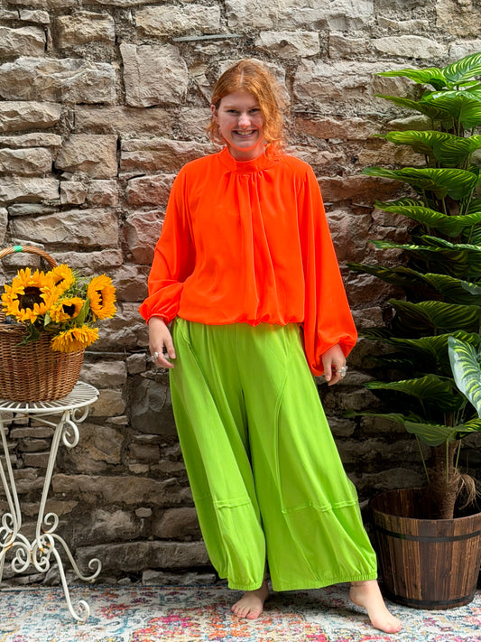 Bright orange bubble hem blouse in one size fits 8-16