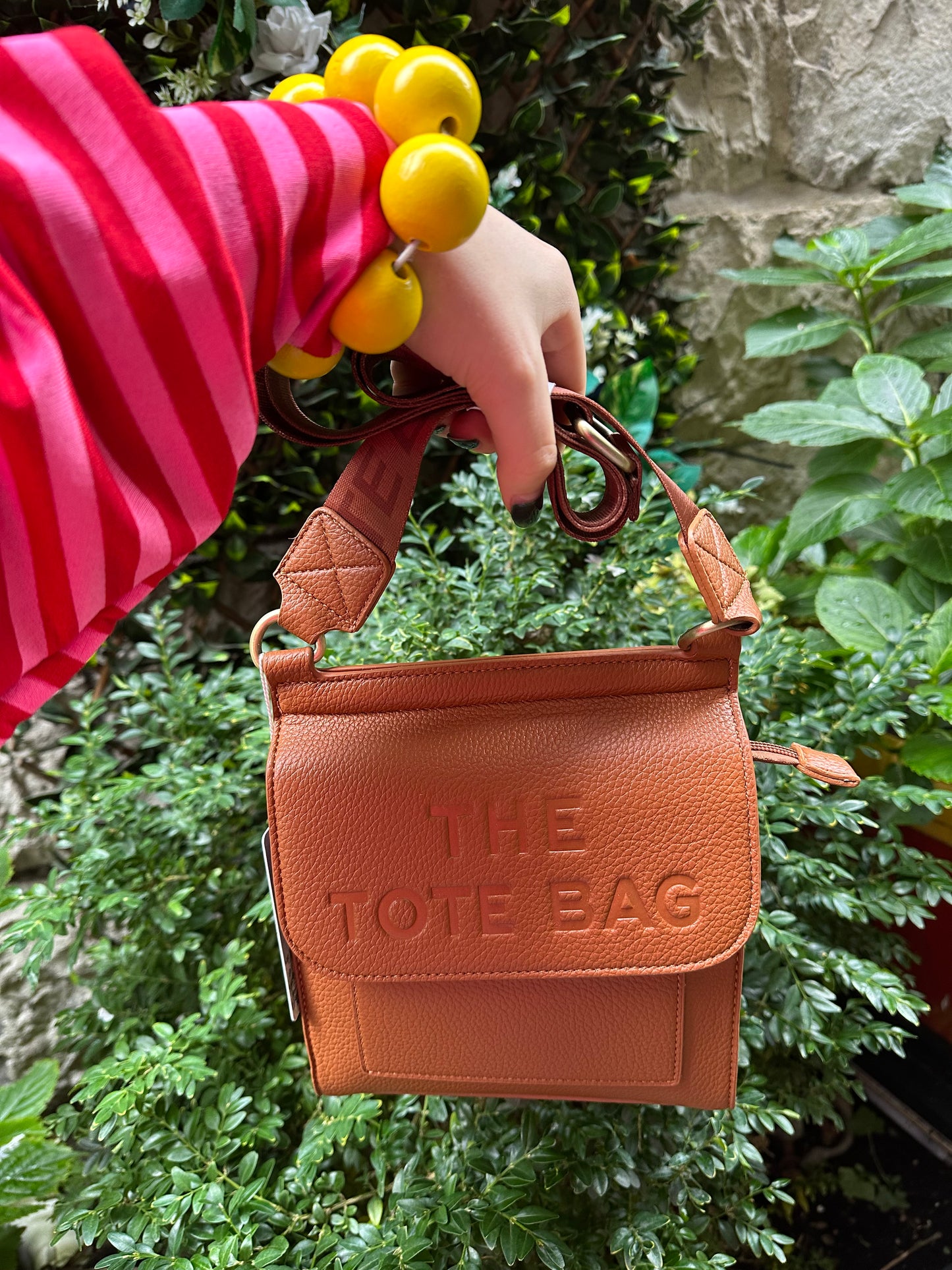The tote bag in brown