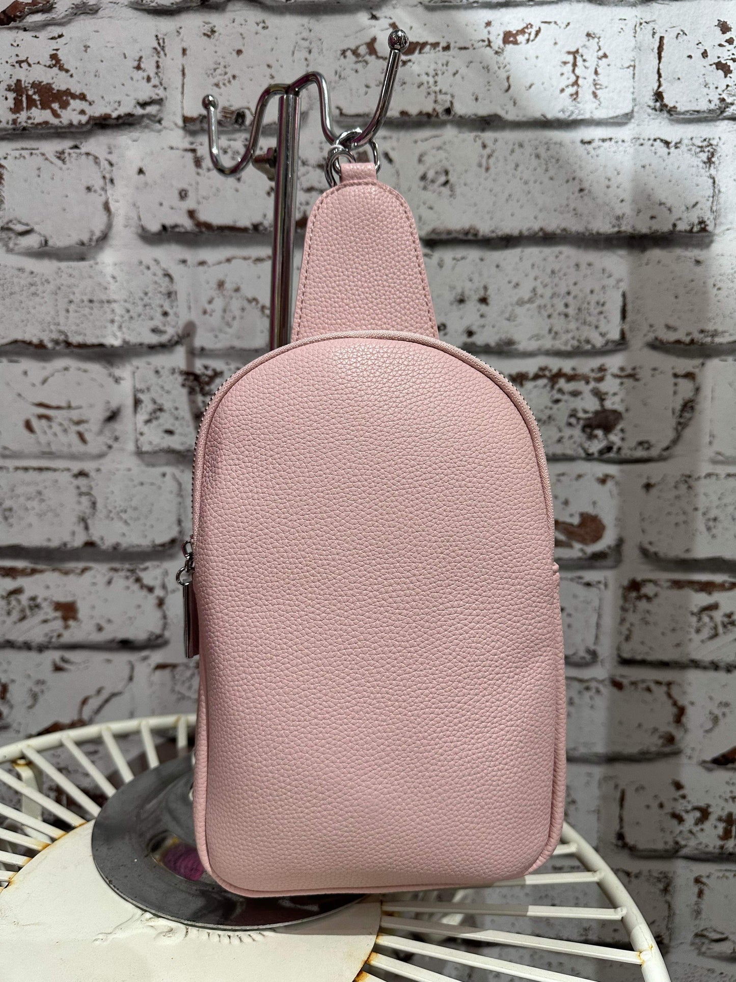 Double zip sling bag in dusty pink